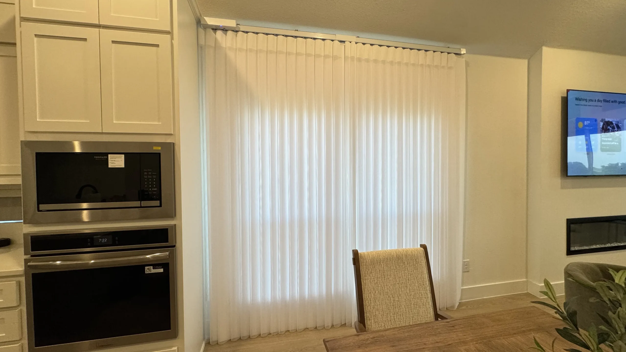 Vertical drapery covering a wide sliding glass door